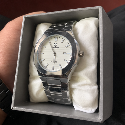 DEARNO silver watch with white dial, three-quarter side angle, in presentation box